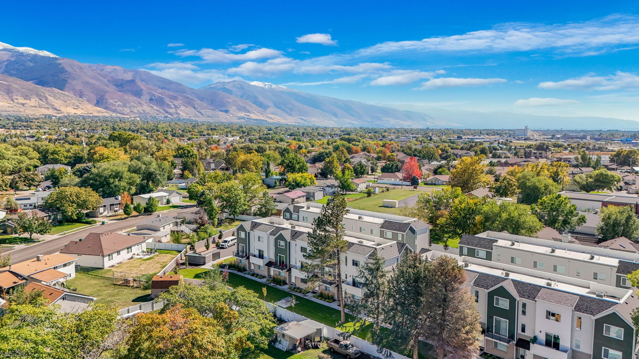 Aerial view of residential area with a mountainous background
