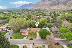 Aerial perspective of suburban area with a mountain backdrop