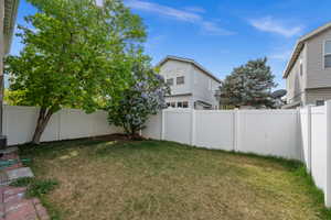 View of fenced backyard