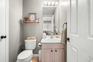 Bathroom featuring vanity and toilet