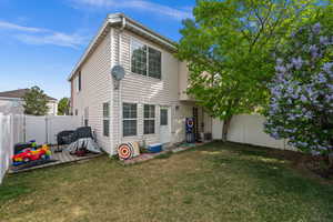 Back of house featuring a fenced backyard