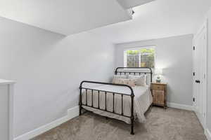 Carpeted bedroom with baseboards