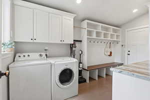 Laundry room featuring cabinet space, recessed lighting, and independent washer and dryer