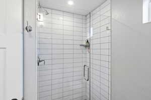 Full bath with a shower stall