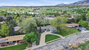 Aerial perspective of suburban area with a water and mountain view