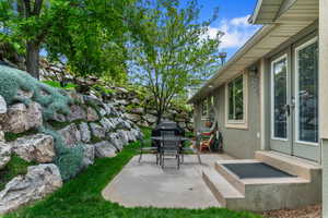 View of patio featuring outdoor dining space and grilling area
