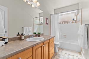 Basement Full bathroom featuring vanity and shower / bath combo