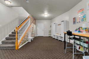 Basement bonus room with under stair play area.