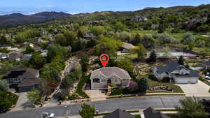 Aerial perspective of suburban area with a mountainous background