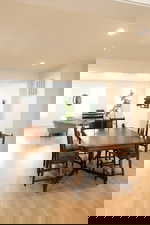 Dining space featuring light wood-style floors and recessed lighting