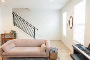 Foyer entrance featuring light wood finished floors and recessed lighting