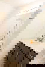 Bathroom with vanity and a shower stall