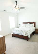 Bedroom featuring ceiling fan and light colored carpet