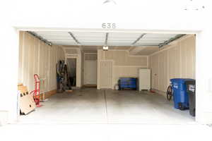 Garage with freestanding refrigerator