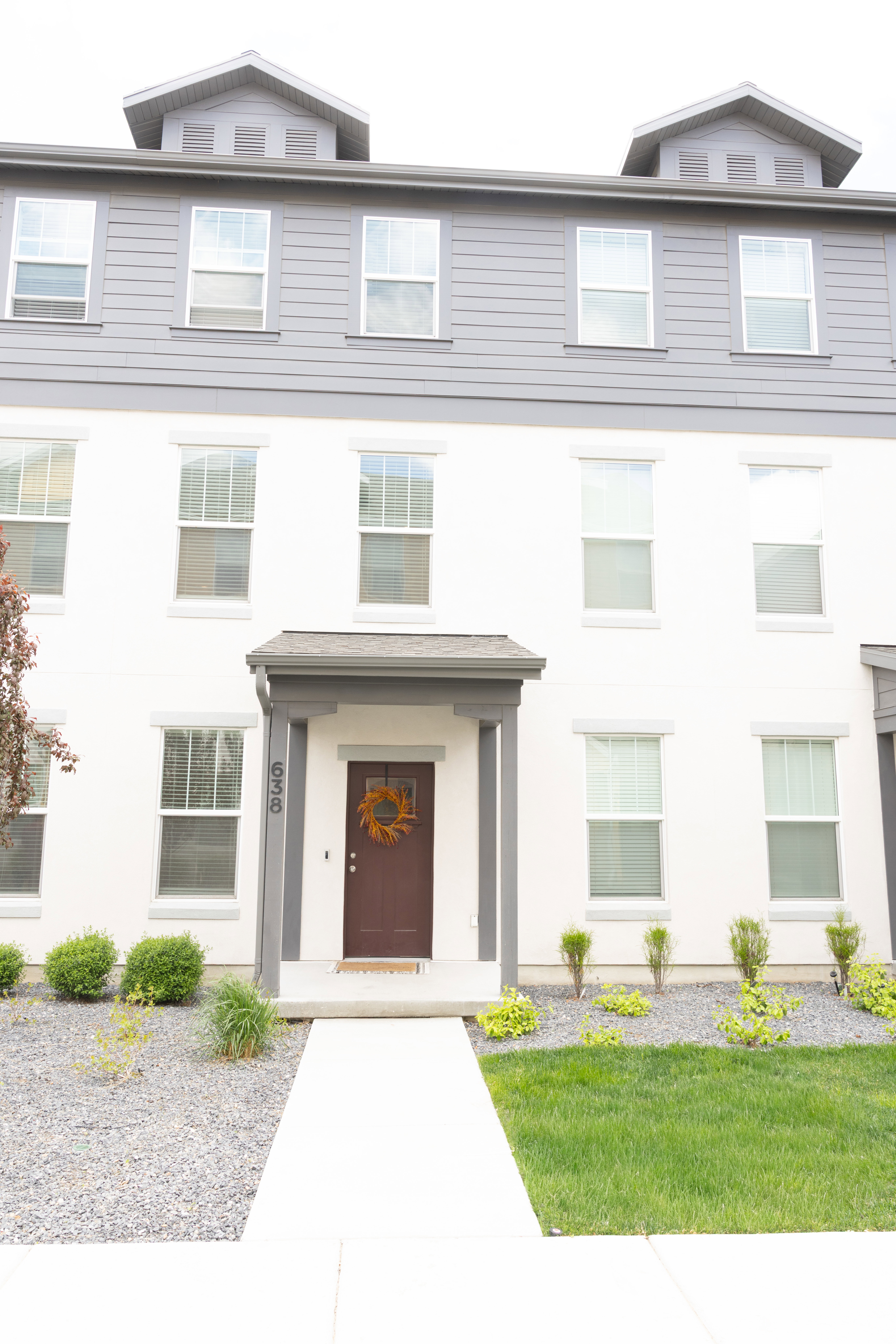 View of front of house featuring stucco siding