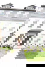 View of front of house featuring stucco siding