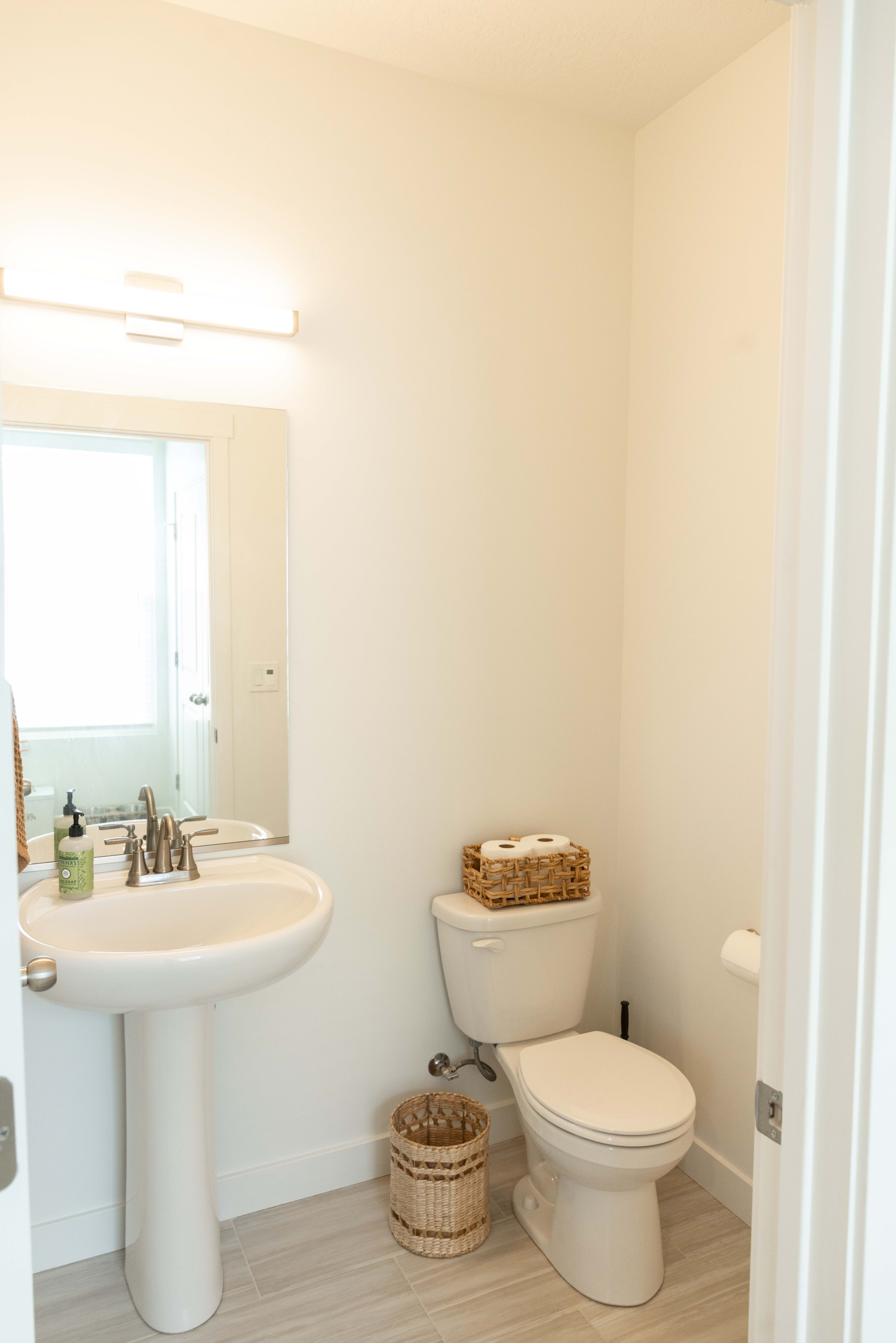 Bathroom with toilet and baseboards