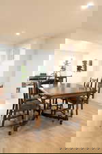 Dining room with recessed lighting and light wood-type flooring