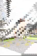 View of front of home featuring a porch and stucco siding