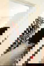 Walk in closet with light carpet