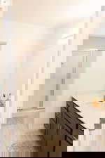 Bathroom with a stall shower and vanity