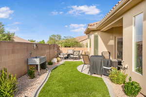 Fenced backyard with a patio area