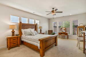 Bedroom featuring ceiling fan, light colored carpet, and recessed lighting