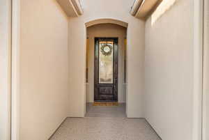 Entrance to property featuring stucco siding
