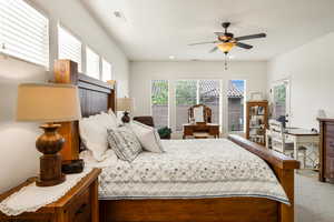 Bedroom featuring light carpet, a ceiling fan, and recessed lighting