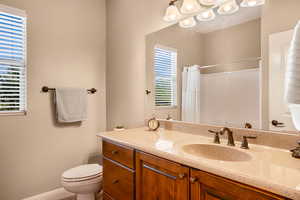 Full bath featuring vanity and a shower with curtain
