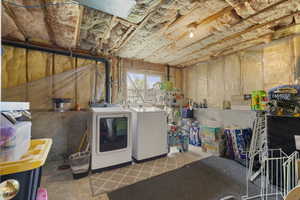 Basement featuring washing machine and clothes dryer