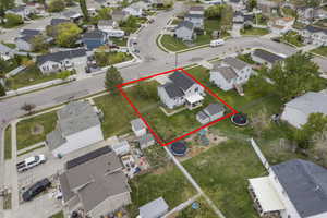 Aerial view of residential area with property parcel outlined