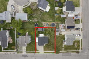 Aerial perspective of suburban area featuring property parcel outlined