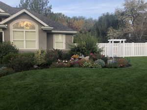 View of property exterior with stucco siding and roof with shingles