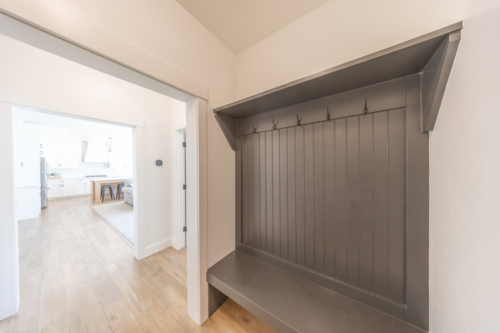 Mudroom featuring light wood finished floors