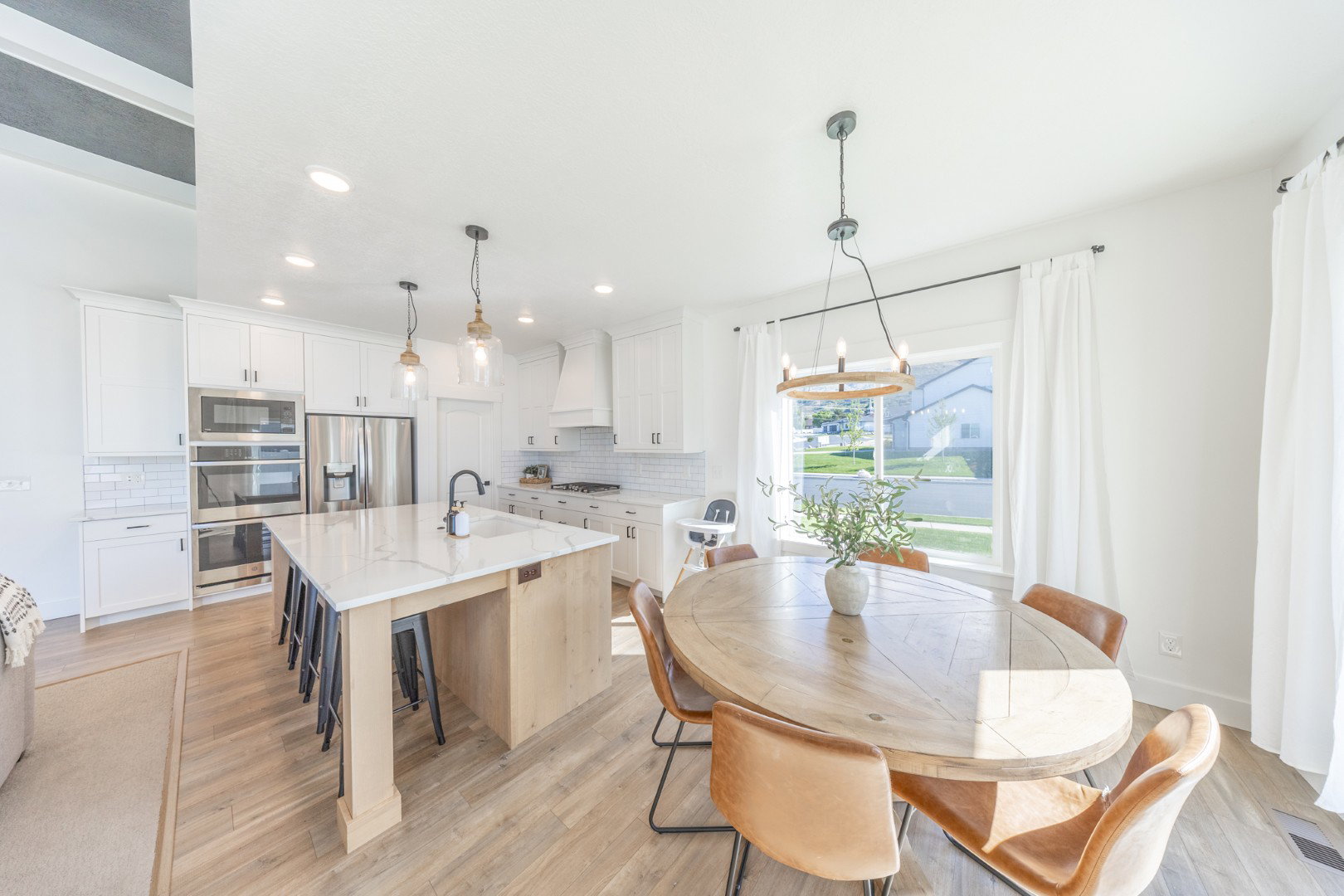 Dining space featuring light wood-type flooring and hanging lights