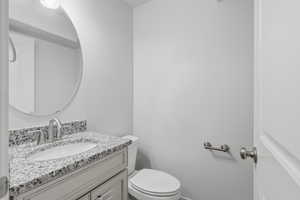 Bathroom with vanity and toilet