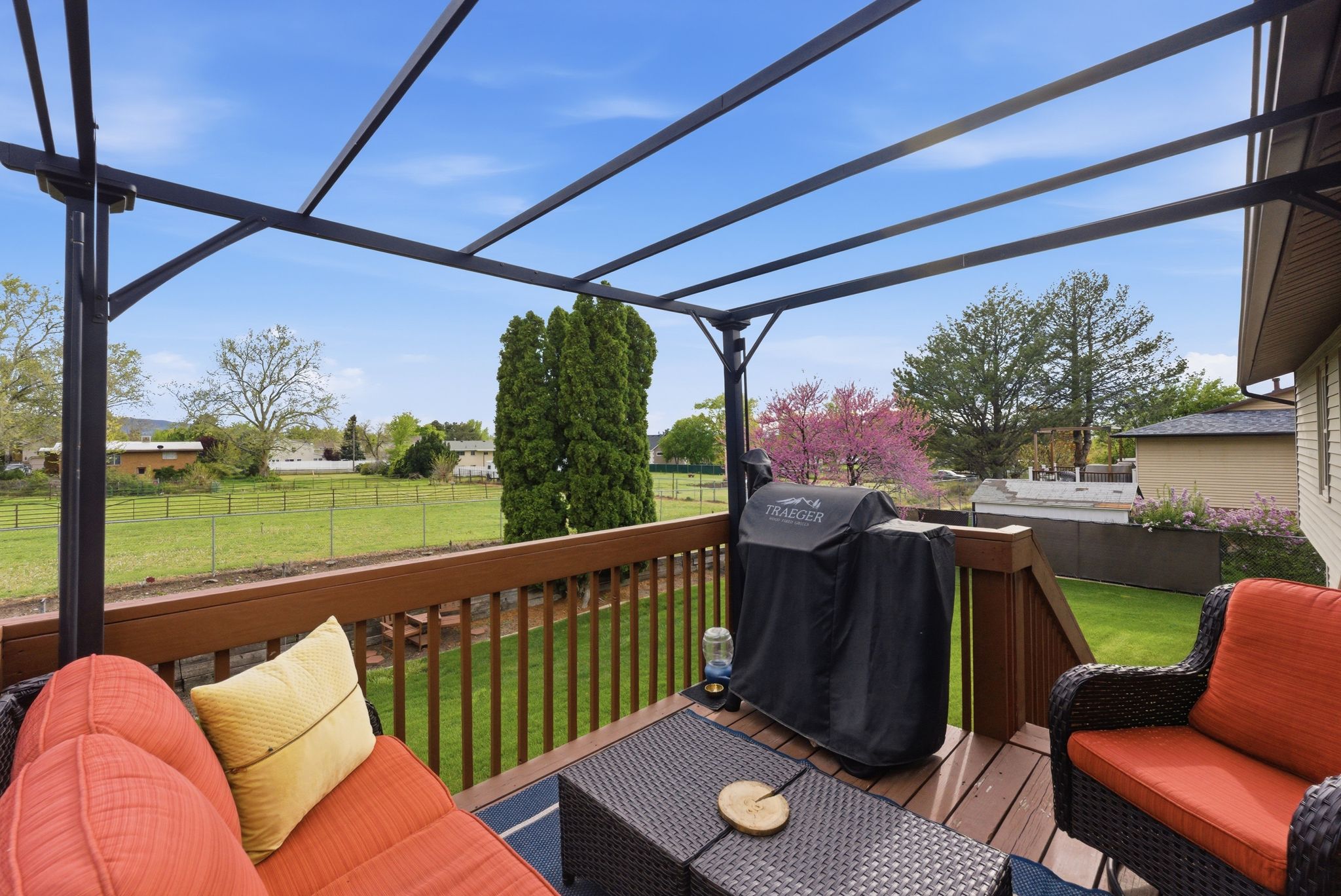 Deck featuring a grill and a fenced backyard
