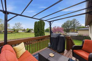 Deck featuring a grill and a fenced backyard