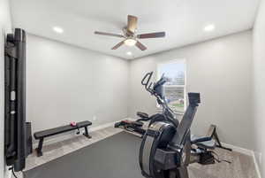 Exercise area featuring light colored carpet, recessed lighting, and a ceiling fan