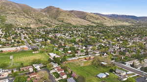 Aerial view of residential area featuring a mountainous background