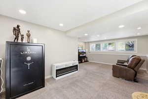 Sitting room featuring light carpet and recessed lighting