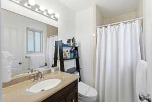 Primary Full bath featuring vanity and a shower with curtain
