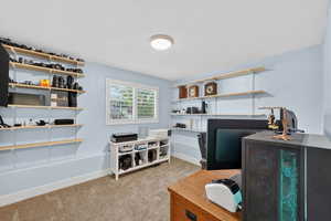 Office featuring light carpet and a textured ceiling