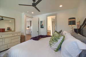 Master bedroom featuring recessed lighting, ceiling fan, and ensuite bathroom