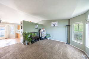 Playroom with lofted ceiling, carpet, and ceiling fan