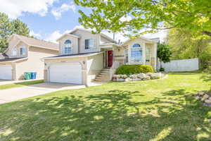 Tri-level home with an attached garage and driveway
