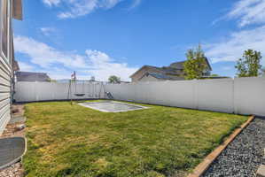 Fenced backyard featuring a patio