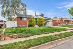 View of front of property featuring brick siding