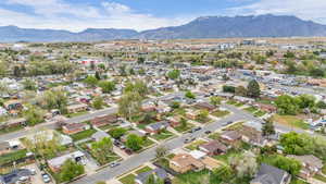 Aerial perspective of suburban area with a mountainous background